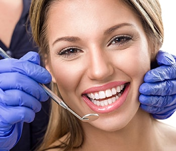 Dr. Stewart South Lakewood Dental Describing Benefits Of Denture